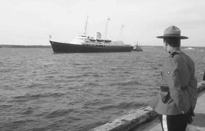Canadian Mountie checks shipping movement at Charlottetown&#x0027;s harbor. &#xA9; Eric Hayes/Woodfin Camp.