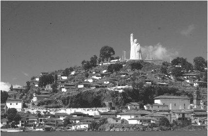 &#x00A9; Kal Muller/Woodfin Camp Janitzio Island lies in P&#x00E1;tzcuaro Lake. Its buildings have white walls and red-tiled roofs. A 40-meter (132-foot) monument of Mexican patriot Jos&#x00E9; Morelos, sculpted from pink stone, stands on the island&#x0027;s highest point.