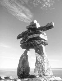 Inukshuk—the word means "like a person"—were built by the Inuit to simulate a man and were placed in such a way as to lead or drive the caribou herds to a place of ambush. They are also used as landmarks. Dan Heringa, Economic Development & Tourism, GNWT.