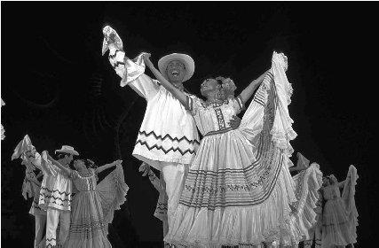 © Peter Langer/EPD Photos The costumes worn by these members of Ballet Folklorico de Mexico are typical of traditional Aguascalientes. Women's dresses combine traditional embroidery and European influences.